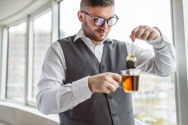 A man drinking the best ginger tea.