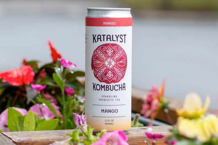 A can of mango flavored Katalyst Kombucha