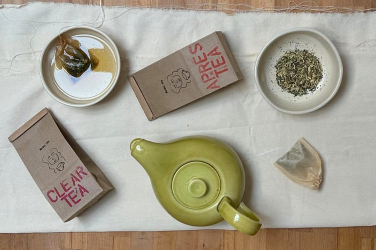 A pot with bags and a mug of Masha Tea, one of the best loose-leaf teas