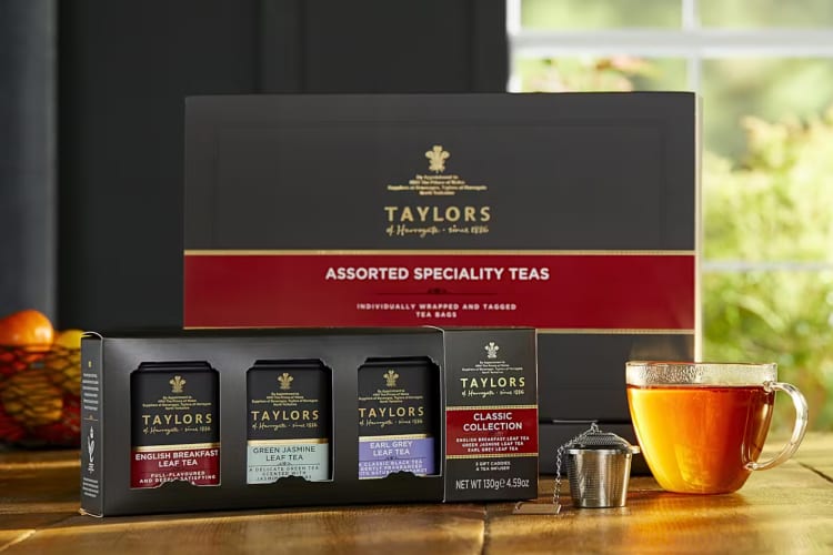 Taylors of Harrogate teas with a strainer and a glass mug of tea