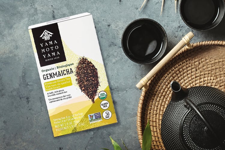 A box of Yamamotoyama tea, one of the best loose-leaf teas, with a pot and two mugs