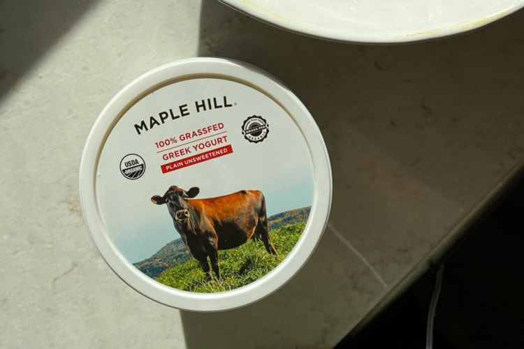 A tub of Maple Hill Unsweetened Greek Yogurt on a counter