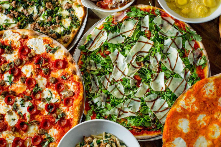 Tie Dye pizzas, which feature vodka sauce, tomato sauce, pesto and fresh mozzarella.