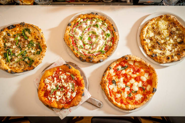 Aerial view of five pizzas from Don Antonio, one of the best restaurants in Times Square