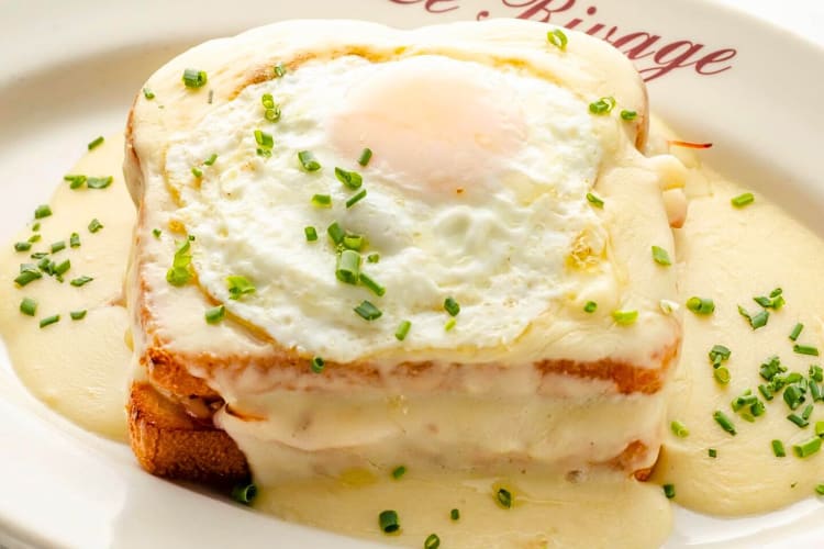 Close-up shot of a croque madame on a plate, from Le Rivage