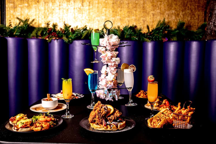 A table full of meals and drinks, from Lagos TSQ, one of the best restaurants in Times Square