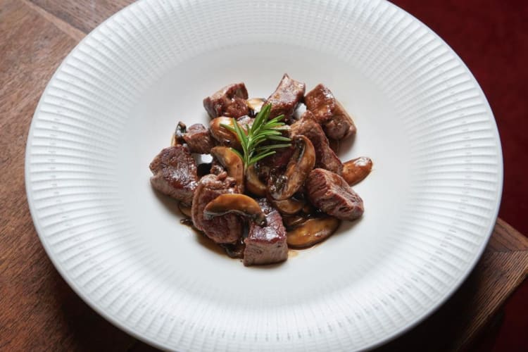 Angus eye fillet melts served with mushrooms