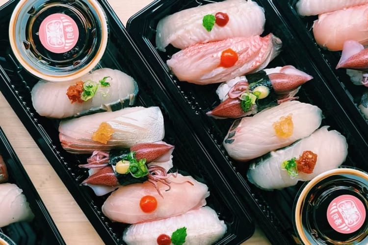 Boxes of takeout sushi.