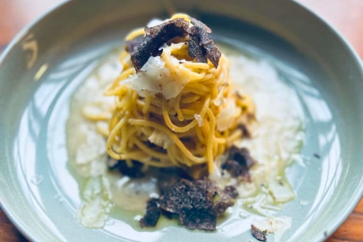 Truffle tonnarelli, served with white truffle butter and marinated black truffles. 