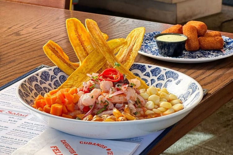 Ceviche with with aji amarillo peppers, served with sweet potato, corn and crispy canchas