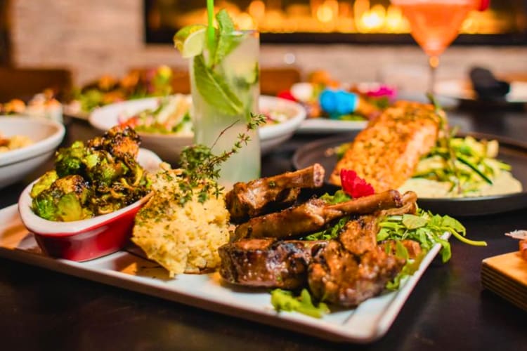 Lamb chomps served with mashed potatoes and Brussels sprouts