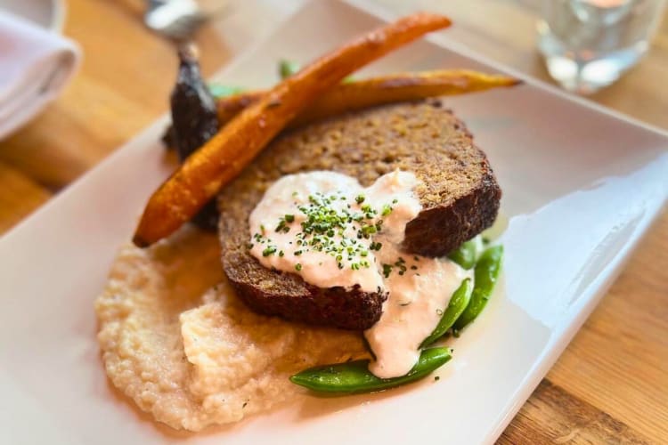 Short rib and pork belly meatloaf with baby carrot, cauliflower mash, sugar snap pea and horseradish crème fraîche