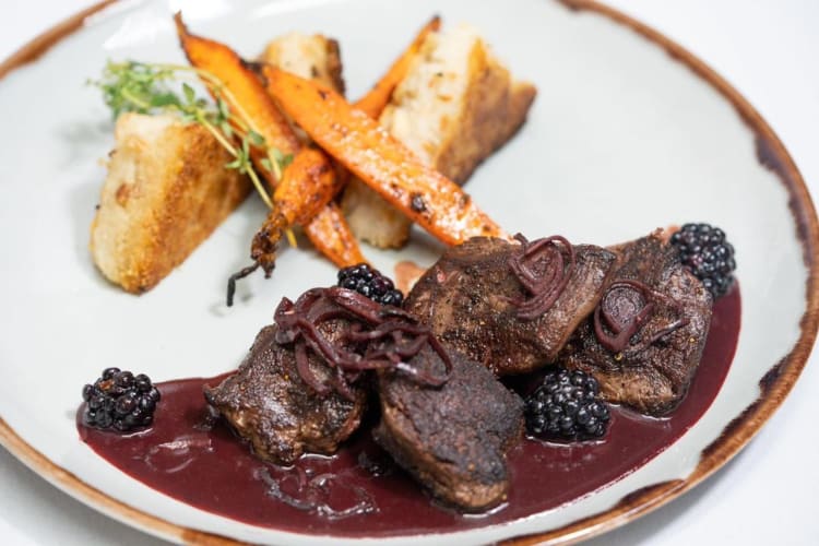 Seared elk tenderloin medallions with balsamic roasted carrots