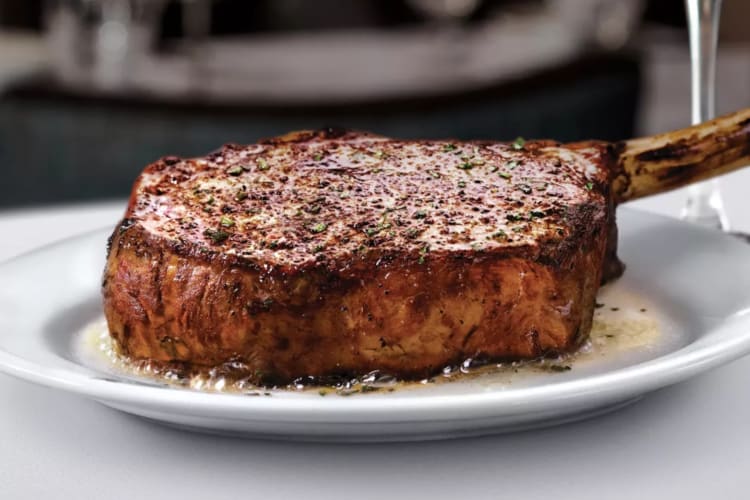 A juicy cowboy ribeye is a perfect dish for a birthday dinner in Salt Lake City