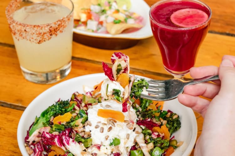 A quinoa salad with two cocktails.
