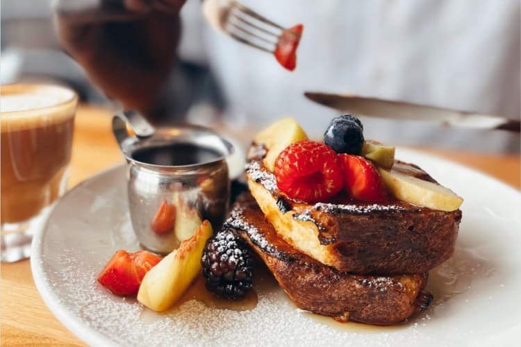 Brioche French toast topped with berries