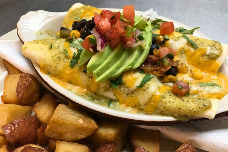 Breakfast enchiladas served with roasted red potatoes