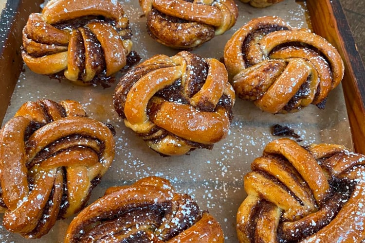 A baking tray full of cinnamon twists