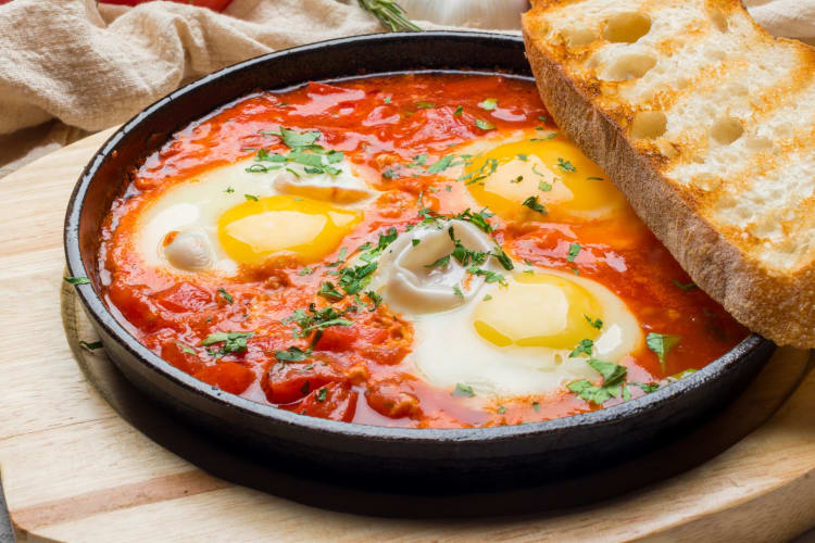 Shakshuka with toast for breakfast in Boston.