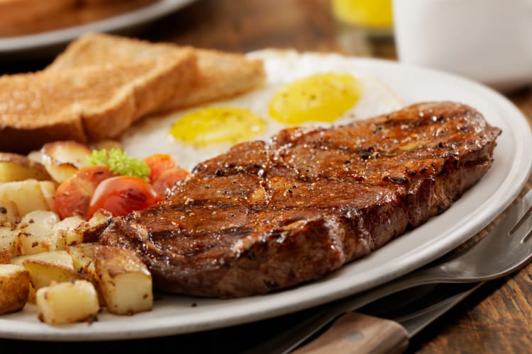 Steak and eggs with toast and home fries for breakfast in Pittsburgh