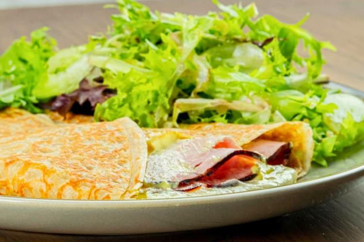 Ham and cheese crêpe served with a side salad 