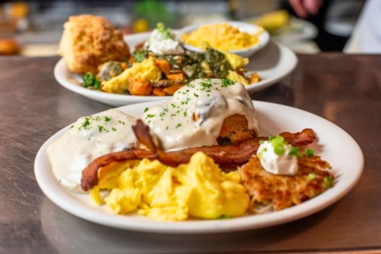 Buttermilk biscuits with hickory-smoked bacon gravy, eggs and a pork sausage patty  