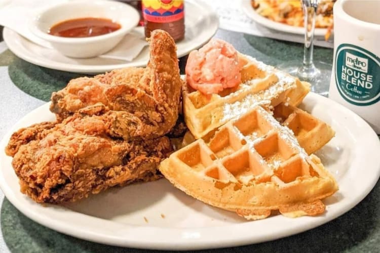 A plate with fried chicken and waffles