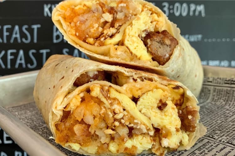 A breakfast burrito filled with egg and hashbrown