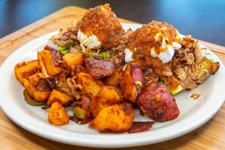 English Muffin, pulled pork, avocados and poached eggs, topped with salsa