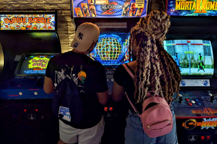 A couple playing games in an arcade