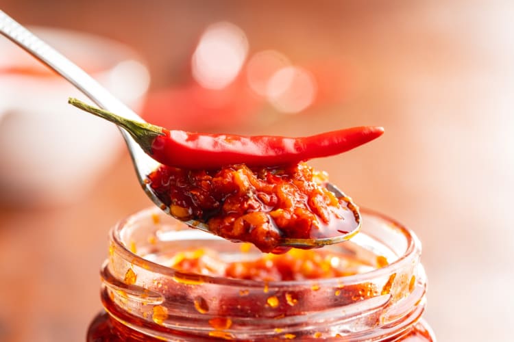 Calabrian chili pepper on top of Calabrian chili paste