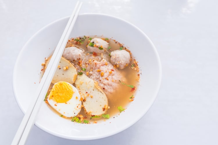 Kuy teav, a popular Cambodian street food with noodles and meatballs