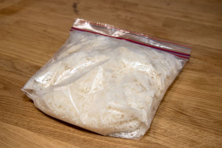 You can freeze cooked rice by allowing it to cool then freezing it in freezer bags.