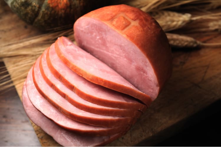 Sliced ham on a cutting board