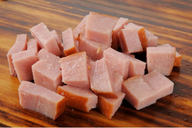 Diced ham on a cutting board