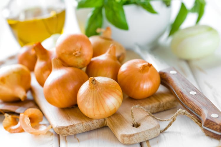 Whole onions, ready to be chopped and frozen.