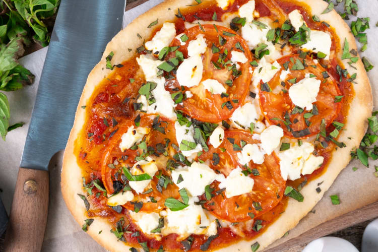 You can freeze pizza dough to make Margherita flatbread