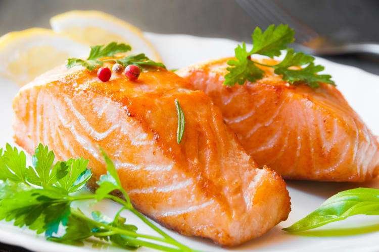 Cooked salmon served with lime