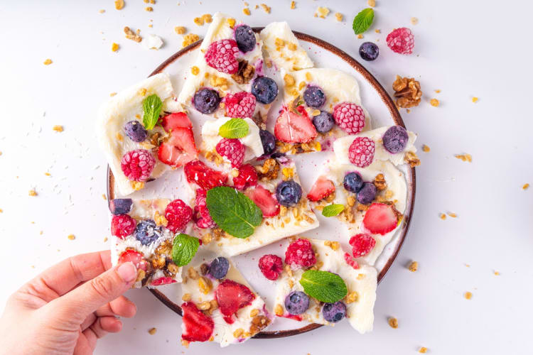 Homemade frozen yogurt bark with fruits and granola