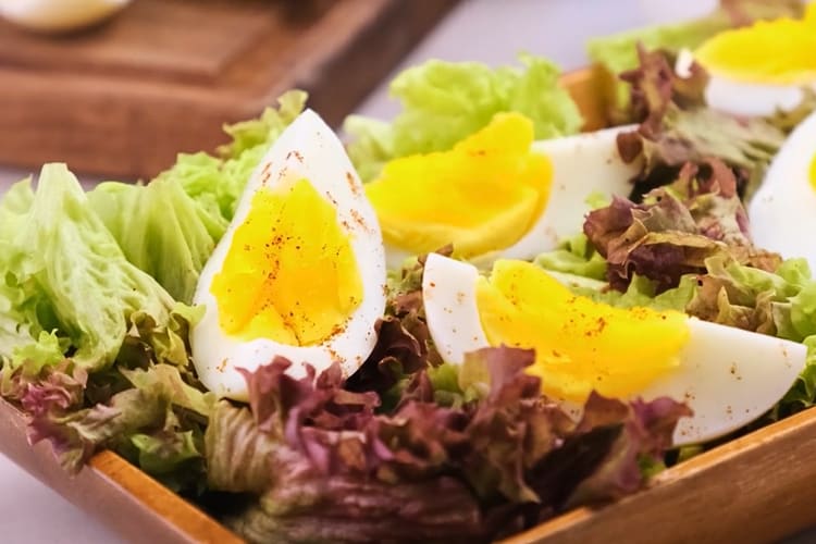Instant Pot hard boiled eggs on a bed of lettuce