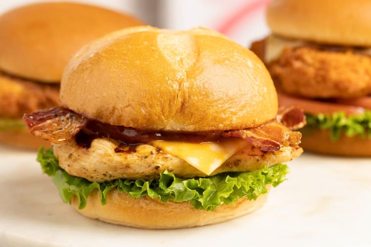 A grilled chicken burger with bacon and cheese from Chick-fil-A