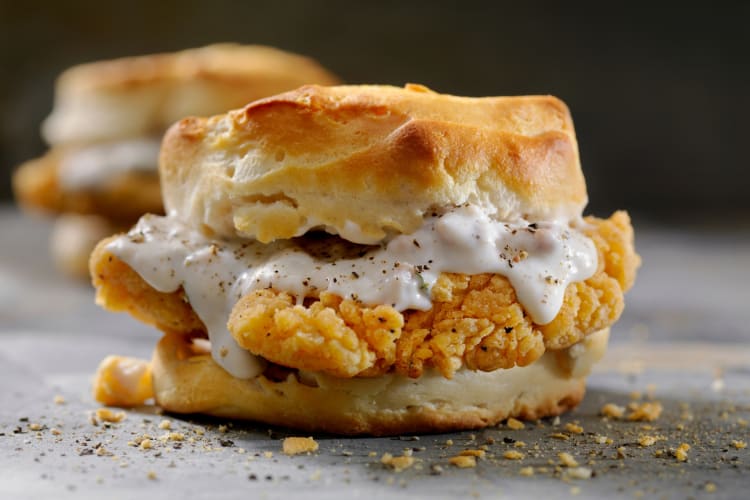 Chicken sandwich with gravy and biscuits