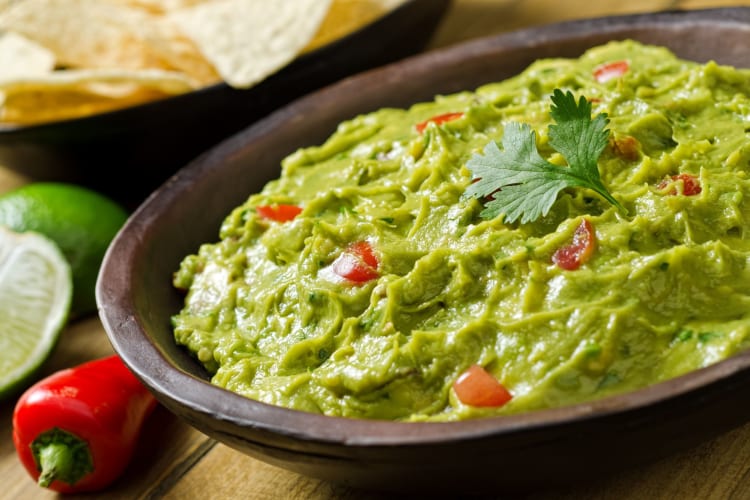 A large bowl of guacamole.