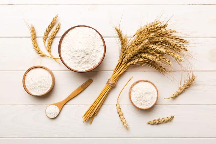 Wheat branches and bowls of wheat flour — a great cornstarch substitute