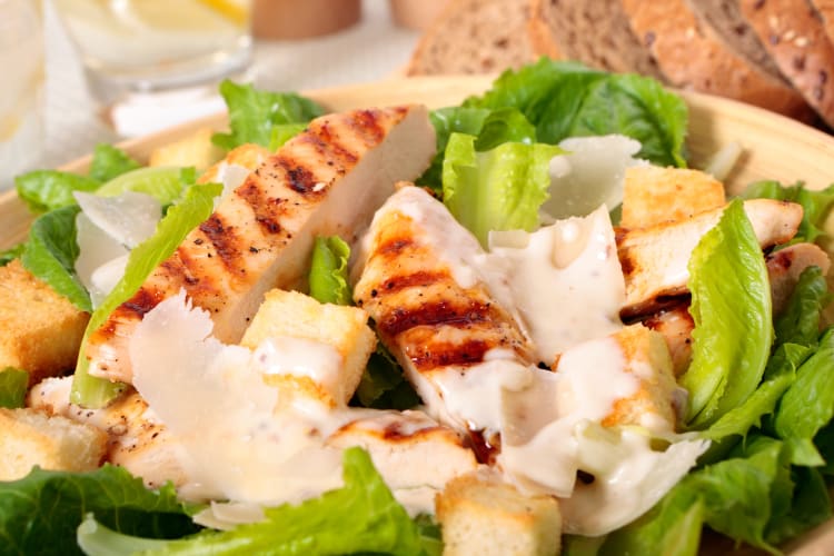 Rotisserie chicken caesar salad with dressing