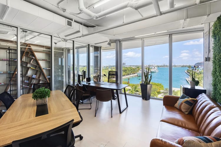 An office area with desks, chairs and a couch, at Nimbler Spaces, a coworking space in Chicago