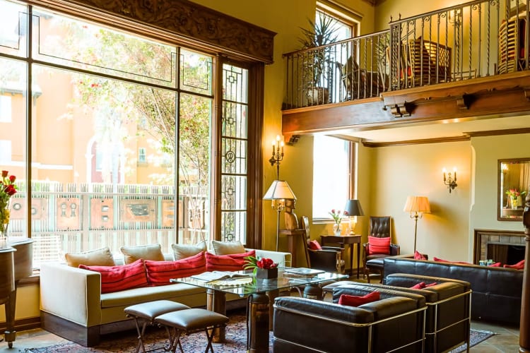 A communal area with couches and a large window at Rita House, a coworking space in Los Angeles