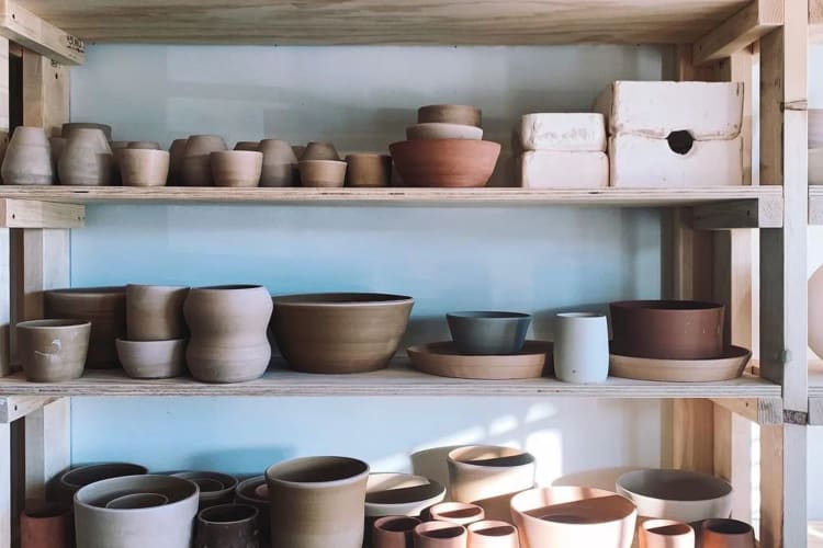 A wall of homemade pottery