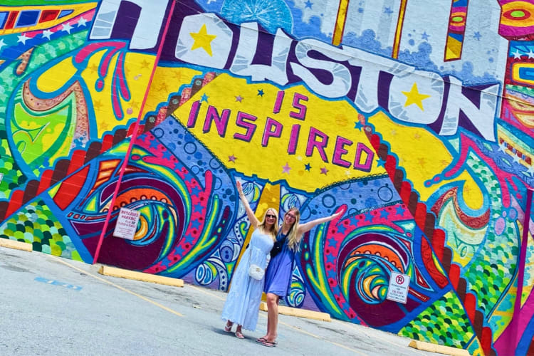 Two women at a Houston mural