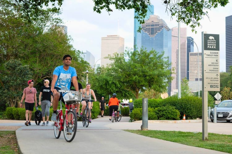 Taking a bike ride outdoors is a nice date idea in Houston